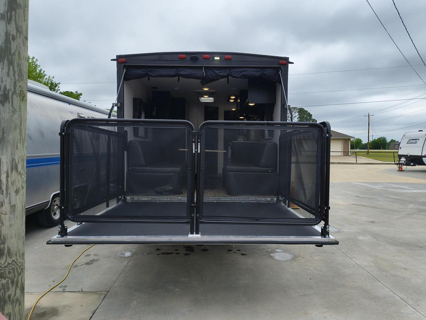 2022 Grey /Black Forest River 22RR - (4X4TCKX20NK) , located at 17760 Hwy 62, Morris, OK, 74445, 35.609104, -95.877060 - SPRING HAS SPRUNG AND SUMMER IS ON THE WAY!!! BIKERS WILL ENJOY THIS TOY HAULER. IT IS READY TO HIT THE ROAD AND ENJOY YOUR SUMMER. THIS CAMPER IS 30FT OVERALL HAS A QUEEN SIZED MASTER BED WITH A CLOSET WARDROBE ON EACH SIDE AND TV MOUNT. THE BATHROOM HAS A STANDUP ENCLOSED SHOWER WITH SINK AND VANI - Photo#39