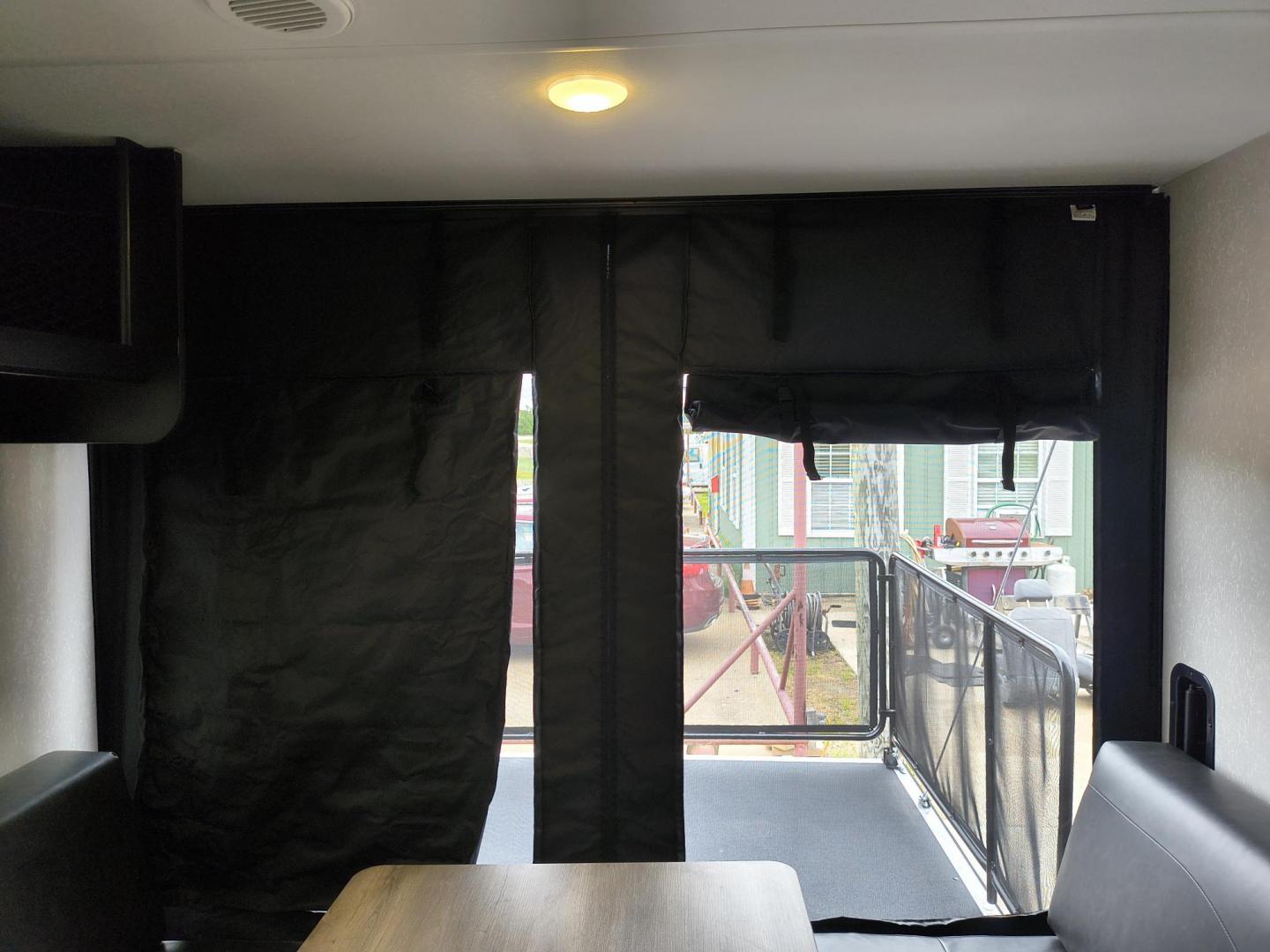 2022 Grey /Black Forest River 22RR - (4X4TCKX20NK) , located at 17760 Hwy 62, Morris, OK, 74445, 35.609104, -95.877060 - SPRING HAS SPRUNG AND SUMMER IS ON THE WAY!!! BIKERS WILL ENJOY THIS TOY HAULER. IT IS READY TO HIT THE ROAD AND ENJOY YOUR SUMMER. THIS CAMPER IS 30FT OVERALL HAS A QUEEN SIZED MASTER BED WITH A CLOSET WARDROBE ON EACH SIDE AND TV MOUNT. THE BATHROOM HAS A STANDUP ENCLOSED SHOWER WITH SINK AND VANI - Photo#44