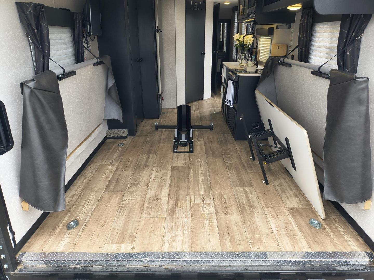 2022 Grey /Black Forest River 22RR - (4X4TCKX20NK) , located at 17760 Hwy 62, Morris, OK, 74445, 35.609104, -95.877060 - SPRING HAS SPRUNG AND SUMMER IS ON THE WAY!!! BIKERS WILL ENJOY THIS TOY HAULER. IT IS READY TO HIT THE ROAD AND ENJOY YOUR SUMMER. THIS CAMPER IS 30FT OVERALL HAS A QUEEN SIZED MASTER BED WITH A CLOSET WARDROBE ON EACH SIDE AND TV MOUNT. THE BATHROOM HAS A STANDUP ENCLOSED SHOWER WITH SINK AND VANI - Photo#45