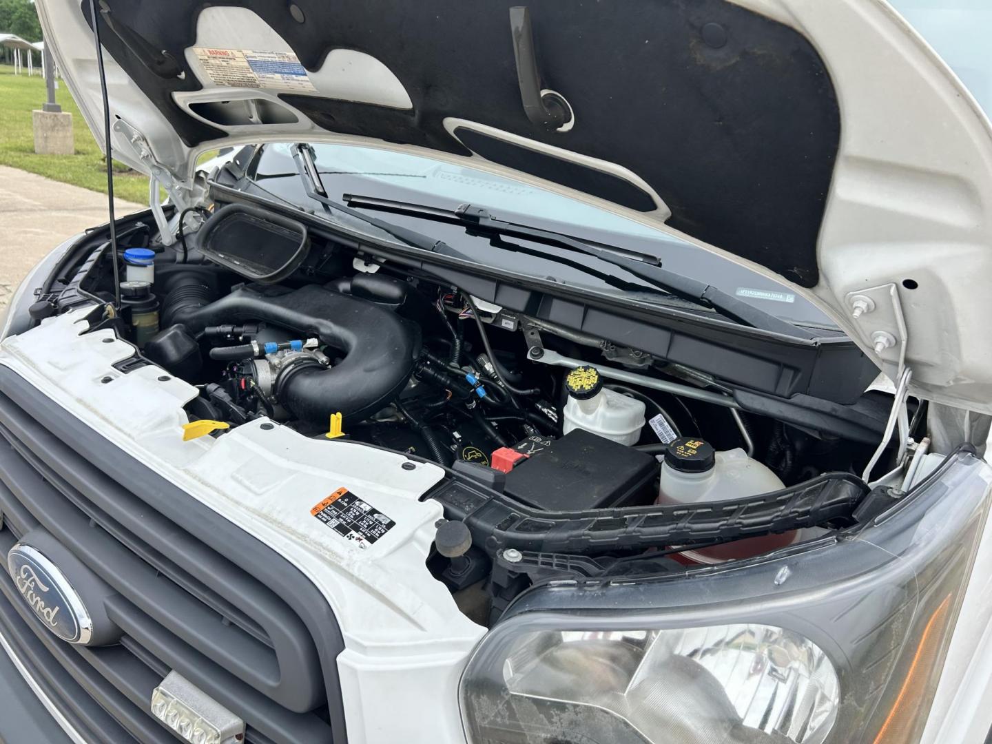 2017 White /GRAY Ford Transit 250 Van high Roof w/Sliding Pass. 148-in. WB (1FTYR2CM9HK) with an 3.7L V6 DOHC 24V engine, 6A transmission, located at 17760 Hwy 62, Morris, OK, 74445, (918) 733-4887, 35.609104, -95.877060 - 2017 FORD TRANSIT 250 HIGH TOP BI-FUEL SYSTEM RUNS ON CNG OR GASOLINE HAS THE 3.7L V6 ENIGINE. ***CLEAN TITLE*** IT FEATURES KEYLESS ENTRY, CLOTH INTERIOR, MANUAL SEATS, POWER WINDOWS, POWER LOCKS, POWER MIRRORS, CRUISE CONTROL, HANDS FREE CALLING, AM/FM RADIO, SIRIUS RADIO, BLUETOOTH RADIO, BACKUP - Photo#25