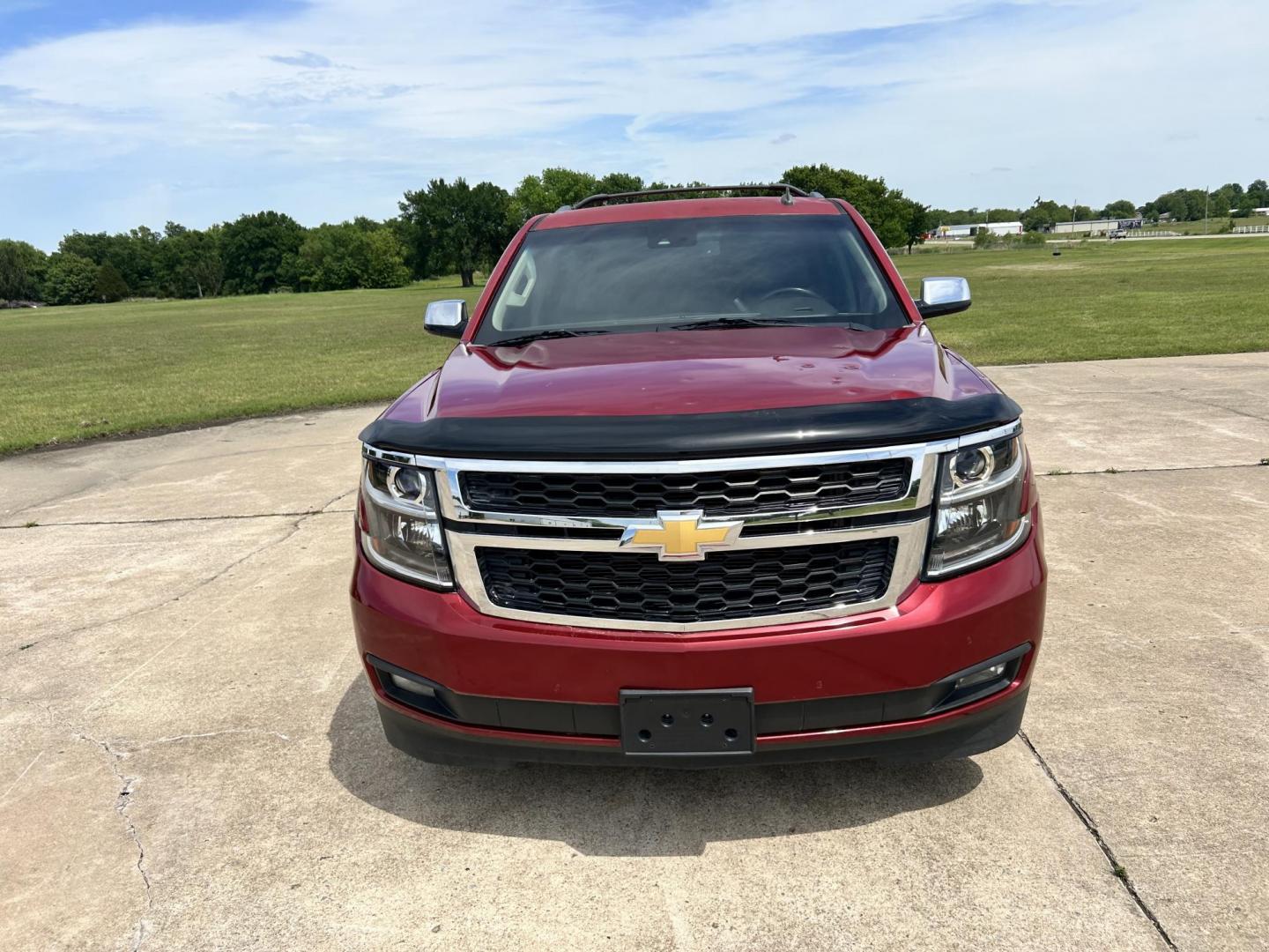 2015 RED /TAN Chevrolet Suburban LT 1500 2WD (1GNSCJKC1FR) with an 5.3L V8 OHV 16V engine, 6-Speed Automatic transmission, located at 17760 Hwy 62, Morris, OK, 74445, (918) 733-4887, 35.609104, -95.877060 - 2015 CHEVY SUBURBAN HAS A 5.3L V8 ENGINE AND IS RWD. POWER LOCKS, POWER WINDOWS, POWER SEATS. PUSH BUTTON START, KEYLESS ENTRY. AM/FM STEREO, SATALITE RADIO, CD PLAYER. EQUIPPED WITH NICE LEATHER SEATS, DUAL AIR, BLUETOOTH, CRUISE CONTROL. HEATED SEATS FRONT AND REAR, ALSO A HEATED STEERING WHEEL - Photo#2