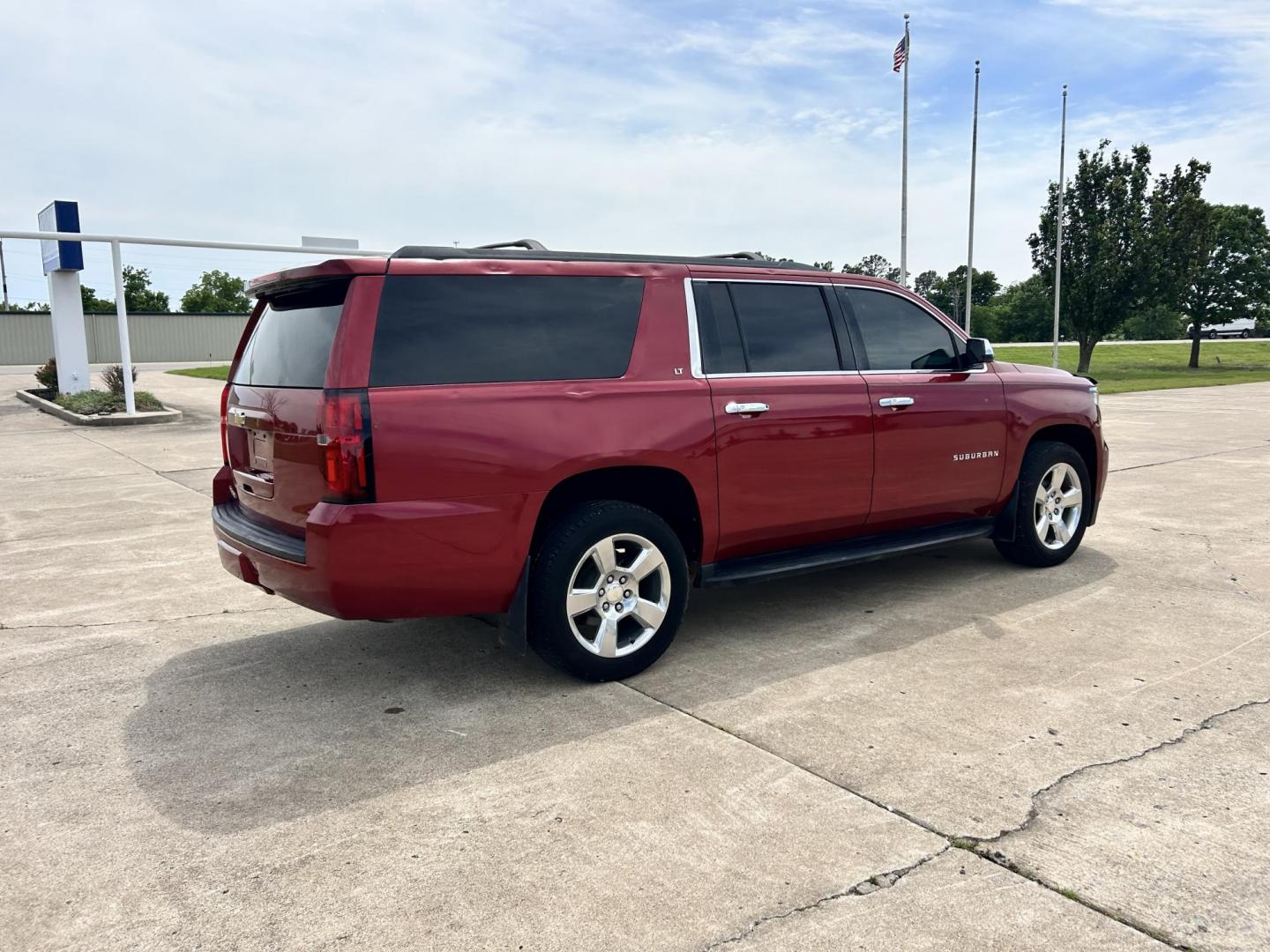 2015 RED /TAN Chevrolet Suburban LT 1500 2WD (1GNSCJKC1FR) with an 5.3L V8 OHV 16V engine, 6-Speed Automatic transmission, located at 17760 Hwy 62, Morris, OK, 74445, (918) 733-4887, 35.609104, -95.877060 - 2015 CHEVY SUBURBAN HAS A 5.3L V8 ENGINE AND IS RWD. POWER LOCKS, POWER WINDOWS, POWER SEATS. PUSH BUTTON START, KEYLESS ENTRY. AM/FM STEREO, SATALITE RADIO, CD PLAYER. EQUIPPED WITH NICE LEATHER SEATS, DUAL AIR, BLUETOOTH, CRUISE CONTROL. HEATED SEATS FRONT AND REAR, ALSO A HEATED STEERING WHEEL - Photo#5