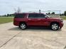 2015 RED /TAN Chevrolet Suburban LT 1500 2WD (1GNSCJKC1FR) with an 5.3L V8 OHV 16V engine, 6-Speed Automatic transmission, located at 17760 Hwy 62, Morris, OK, 74445, (918) 733-4887, 35.609104, -95.877060 - 2015 CHEVY SUBURBAN HAS A 5.3L V8 ENGINE AND IS RWD. POWER LOCKS, POWER WINDOWS, POWER SEATS. PUSH BUTTON START, KEYLESS ENTRY. AM/FM STEREO, SATALITE RADIO, CD PLAYER. EQUIPPED WITH NICE LEATHER SEATS, DUAL AIR, BLUETOOTH, CRUISE CONTROL. HEATED SEATS FRONT AND REAR, ALSO A HEATED STEERING WHEEL - Photo#4