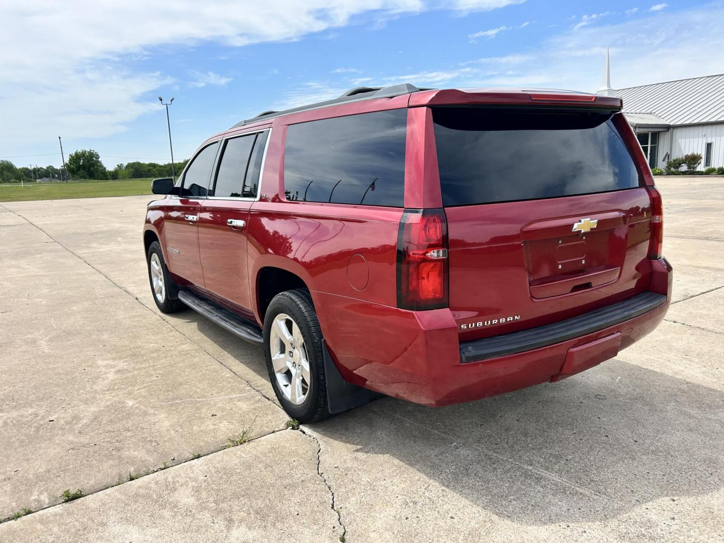 2015 RED /TAN Chevrolet Suburban LT 1500 2WD (1GNSCJKC1FR) with an 5.3L V8 OHV 16V engine, 6-Speed Automatic transmission, located at 17760 Hwy 62, Morris, OK, 74445, (918) 733-4887, 35.609104, -95.877060 - 2015 CHEVY SUBURBAN HAS A 5.3L V8 ENGINE AND IS RWD. POWER LOCKS, POWER WINDOWS, POWER SEATS. PUSH BUTTON START, KEYLESS ENTRY. AM/FM STEREO, SATALITE RADIO, CD PLAYER. EQUIPPED WITH NICE LEATHER SEATS, DUAL AIR, BLUETOOTH, CRUISE CONTROL. HEATED SEATS FRONT AND REAR, ALSO A HEATED STEERING WHEEL - Photo#7