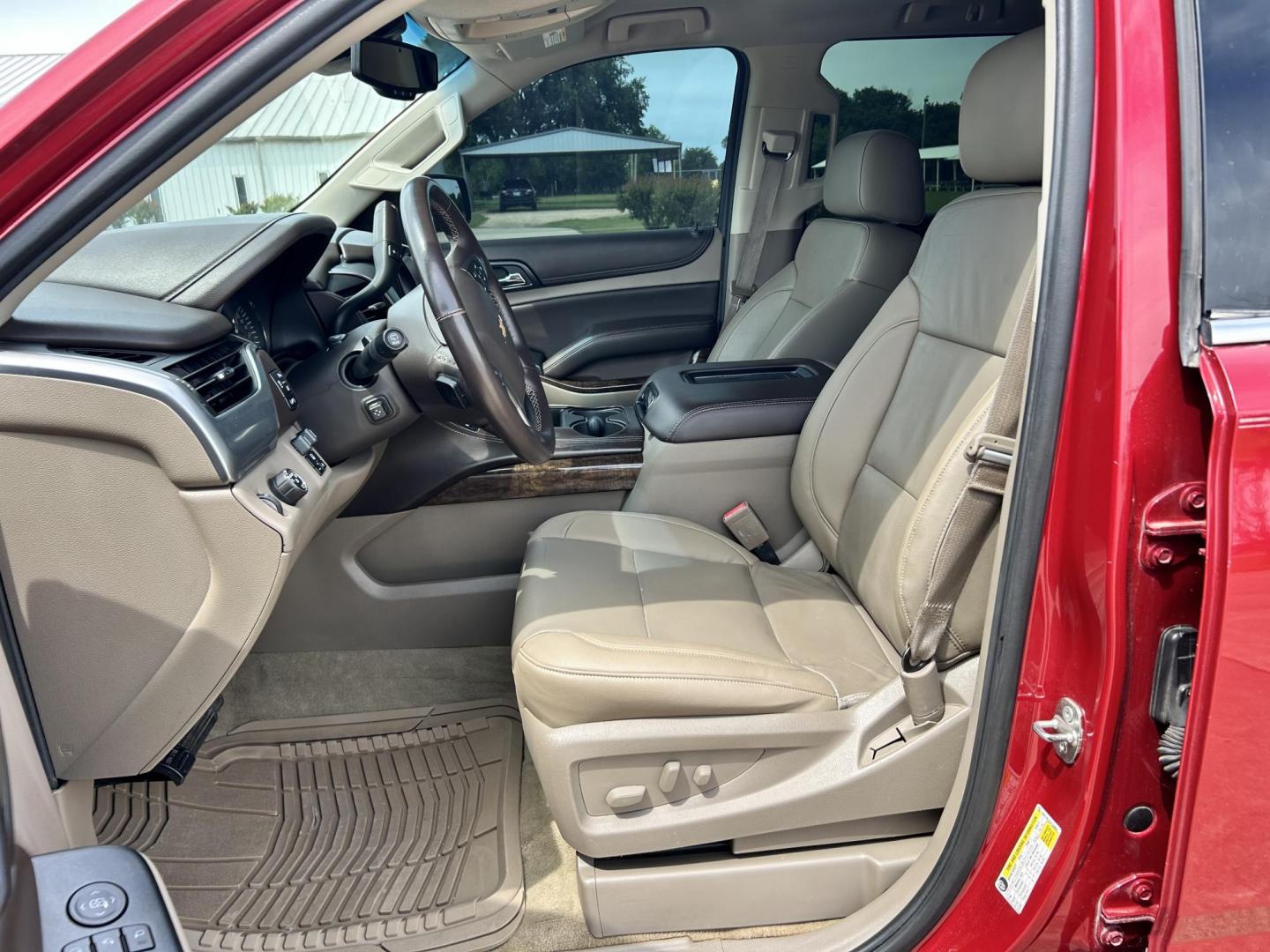 2015 RED /TAN Chevrolet Suburban LT 1500 2WD (1GNSCJKC1FR) with an 5.3L V8 OHV 16V engine, 6-Speed Automatic transmission, located at 17760 Hwy 62, Morris, OK, 74445, (918) 733-4887, 35.609104, -95.877060 - 2015 CHEVY SUBURBAN HAS A 5.3L V8 ENGINE AND IS RWD. POWER LOCKS, POWER WINDOWS, POWER SEATS. PUSH BUTTON START, KEYLESS ENTRY. AM/FM STEREO, SATALITE RADIO, CD PLAYER. EQUIPPED WITH NICE LEATHER SEATS, DUAL AIR, BLUETOOTH, CRUISE CONTROL. HEATED SEATS FRONT AND REAR, ALSO A HEATED STEERING WHEEL - Photo#9