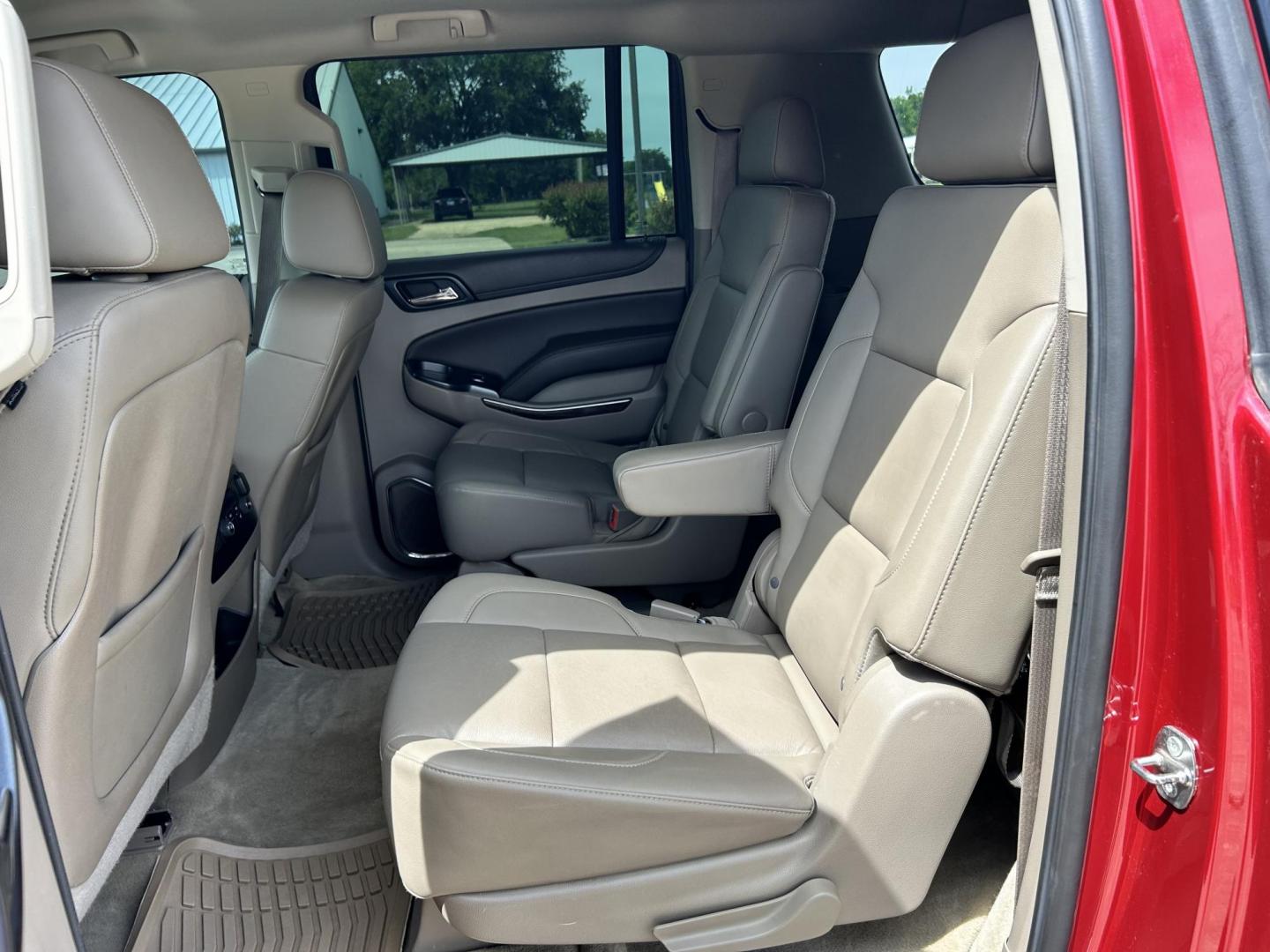 2015 RED /TAN Chevrolet Suburban LT 1500 2WD (1GNSCJKC1FR) with an 5.3L V8 OHV 16V engine, 6-Speed Automatic transmission, located at 17760 Hwy 62, Morris, OK, 74445, (918) 733-4887, 35.609104, -95.877060 - 2015 CHEVY SUBURBAN HAS A 5.3L V8 ENGINE AND IS RWD. POWER LOCKS, POWER WINDOWS, POWER SEATS. PUSH BUTTON START, KEYLESS ENTRY. AM/FM STEREO, SATALITE RADIO, CD PLAYER. EQUIPPED WITH NICE LEATHER SEATS, DUAL AIR, BLUETOOTH, CRUISE CONTROL. HEATED SEATS FRONT AND REAR, ALSO A HEATED STEERING WHEEL - Photo#15