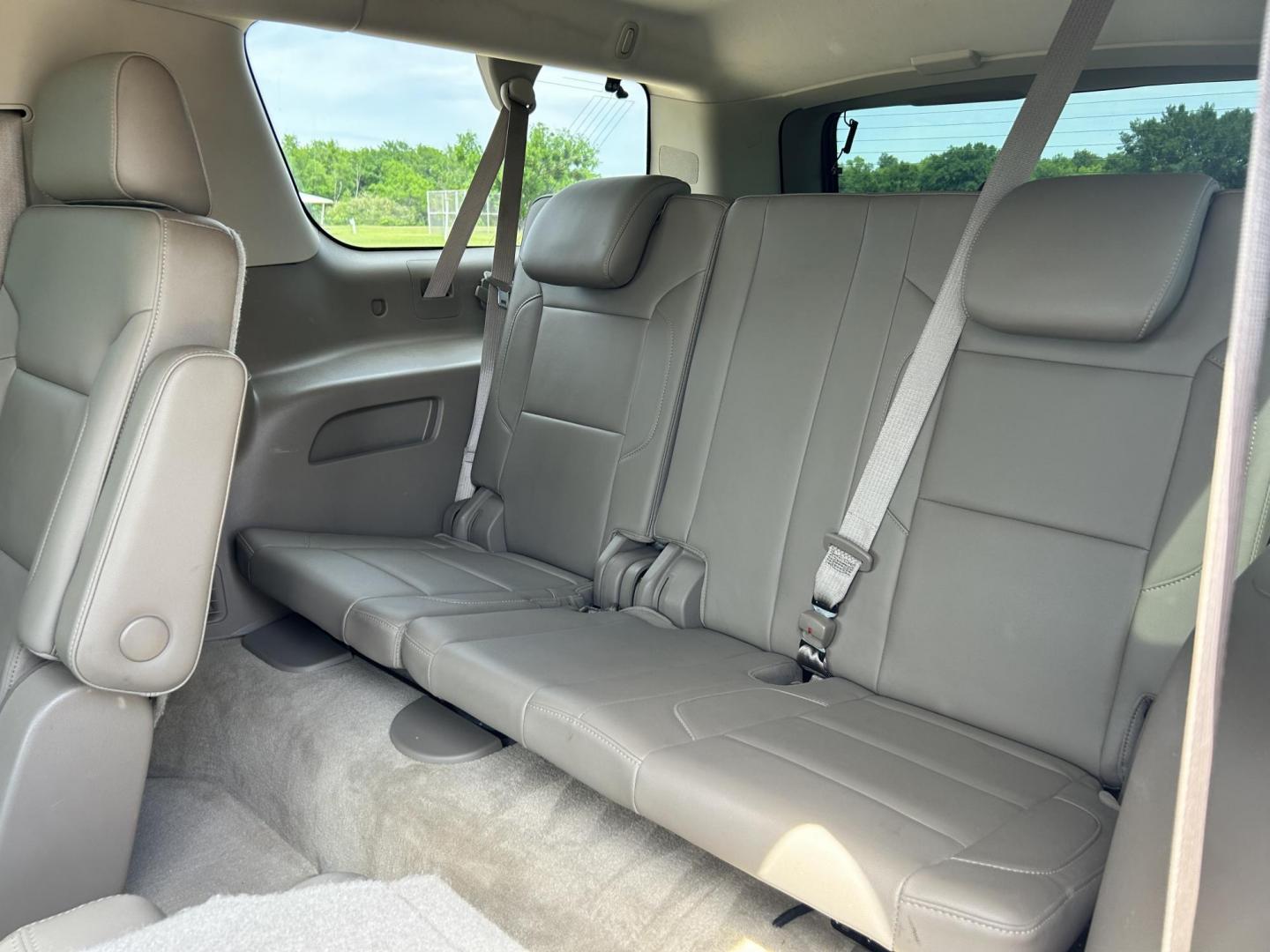2015 RED /TAN Chevrolet Suburban LT 1500 2WD (1GNSCJKC1FR) with an 5.3L V8 OHV 16V engine, 6-Speed Automatic transmission, located at 17760 Hwy 62, Morris, OK, 74445, (918) 733-4887, 35.609104, -95.877060 - 2015 CHEVY SUBURBAN HAS A 5.3L V8 ENGINE AND IS RWD. POWER LOCKS, POWER WINDOWS, POWER SEATS. PUSH BUTTON START, KEYLESS ENTRY. AM/FM STEREO, SATALITE RADIO, CD PLAYER. EQUIPPED WITH NICE LEATHER SEATS, DUAL AIR, BLUETOOTH, CRUISE CONTROL. HEATED SEATS FRONT AND REAR, ALSO A HEATED STEERING WHEEL - Photo#16