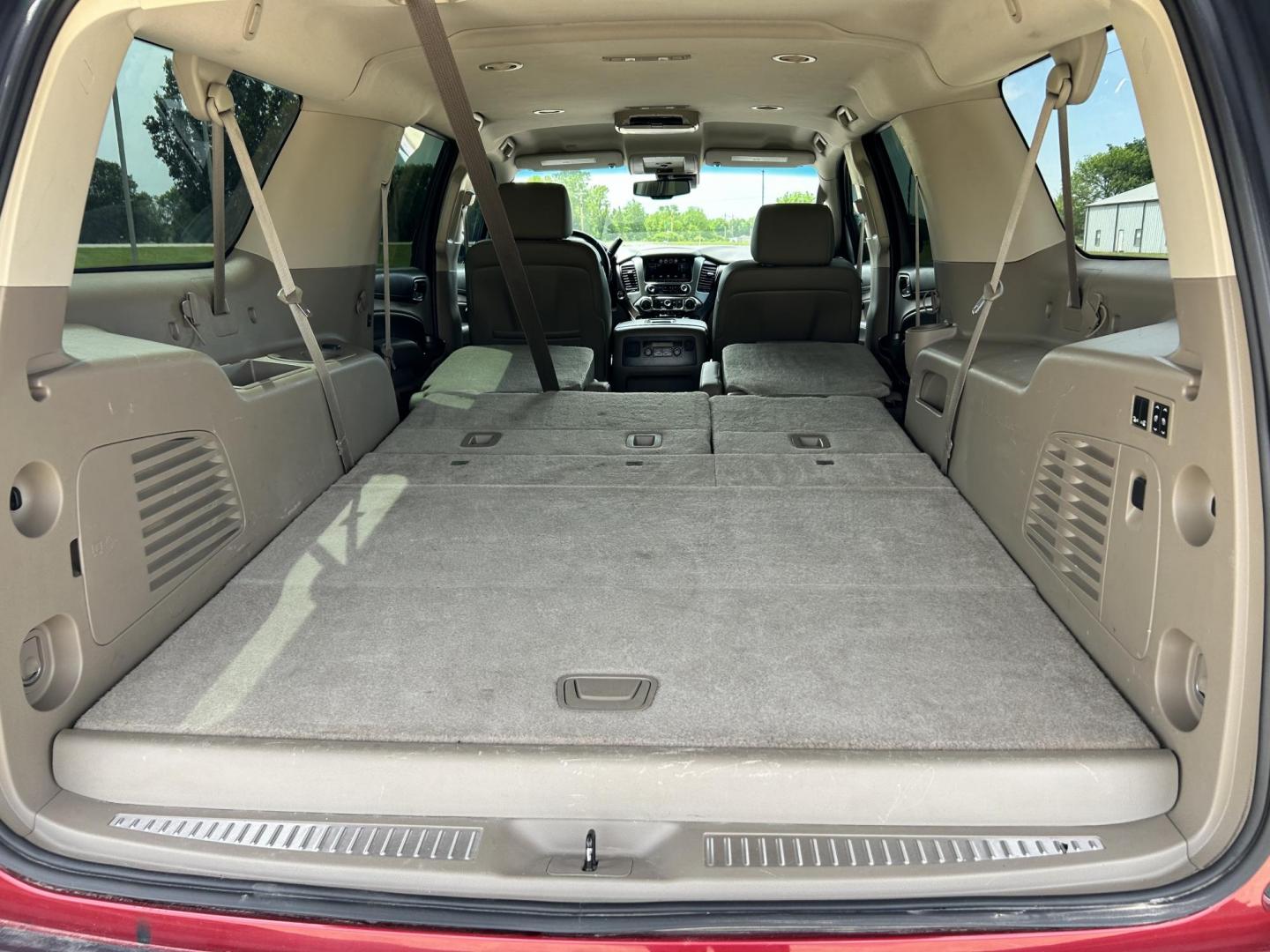 2015 RED /TAN Chevrolet Suburban LT 1500 2WD (1GNSCJKC1FR) with an 5.3L V8 OHV 16V engine, 6-Speed Automatic transmission, located at 17760 Hwy 62, Morris, OK, 74445, (918) 733-4887, 35.609104, -95.877060 - 2015 CHEVY SUBURBAN HAS A 5.3L V8 ENGINE AND IS RWD. POWER LOCKS, POWER WINDOWS, POWER SEATS. PUSH BUTTON START, KEYLESS ENTRY. AM/FM STEREO, SATALITE RADIO, CD PLAYER. EQUIPPED WITH NICE LEATHER SEATS, DUAL AIR, BLUETOOTH, CRUISE CONTROL. HEATED SEATS FRONT AND REAR, ALSO A HEATED STEERING WHEEL - Photo#20