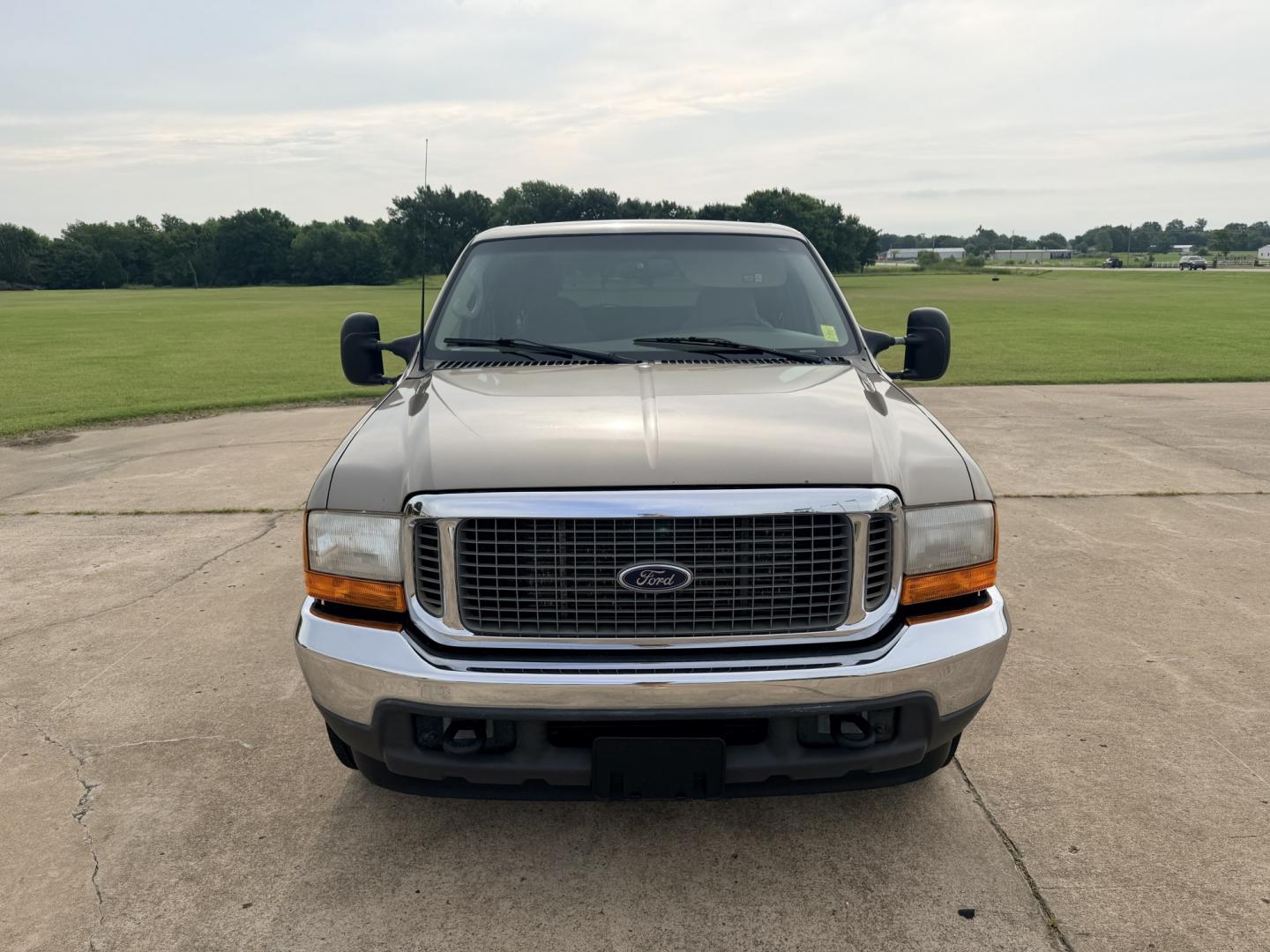 2000 GOLD /TAN Ford Excursion XLT 2WD (1FMNU40SXYE) with an 6.8L V10 SOHC 20V engine, 4A OD transmission, located at 17760 Hwy 62, Morris, OK, 74445, (918) 733-4887, 35.609104, -95.877060 - 2000 FORD EXCURSION 2WD HAS 6.8L V10 ENGINE. FEATURING POWER LOCKS, POWER WINDOWS, POWER SEATS, POWER MIRRORS, CLOTH INTERIOR, AM/FM STEREO, CD PLAYER, CASSETTE PLAYER, REAR CLIMATE CONTROL, CRUISE CONTROL, AND 3RD ROW SEATING. TIRES LT265/75R16 TIRES AND 217,879 MILES. HAS A CLEAN TITLE. WE OFFER- Photo#1