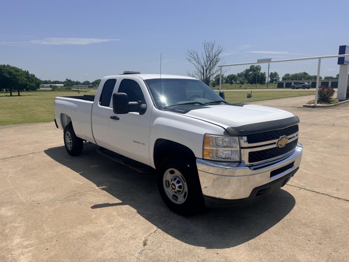 2013 White /BLACK Chevrolet Silverado 2500HD Work Truck Ext. Cab 2WD (1GC2CVCB0DZ) with an 6.0L V8 OHV 16V CNG engine, 6A transmission, located at 17760 Hwy 62, Morris, OK, 74445, (918) 733-4887, 35.609104, -95.877060 - 2013 CHEVY SILVERADO 2500 HD 2WD BI-FUEL SYSTEM RUNS ON CNG OR GASOLINE WITH THE 6.0L V8 ENGINE. IT FEATURES MANUAL SEATS, CLOTH INTERIOR, POWER LOCKS, MANUAL WINDOWS, AM/FM RADIO, CRUSIE CONTROL, TRACTION CONTROL, TAILER BRAKES, SAFETY LIGHT AND BED MATT. ONLY 179,449 MILES WITH FIRESTONE TIRES 245- Photo#3