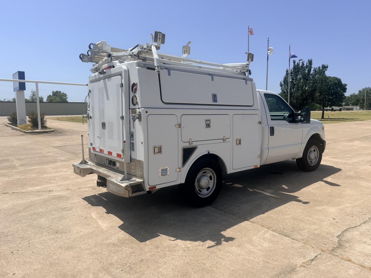 2013 White /GRAY Ford F-350 SD (1FDRF3A66DE) with an 6.2L V8 OHV 16V engine, 6A transmission, located at 17760 Hwy 62, Morris, OK, 74445, (918) 733-4887, 35.609104, -95.877060 - 2013 FORD F-350 6.2 V8 RWD DEDICATED CNG ONLY RUNS ON COMPRESSED NATURAL GAS AND DOES NOT RUN ON GASOLINE. FEATURES MANUAL SEATS, MANUAL LOCKS, MANUAL WINDOWS, MANUAL MIRRORS, AM/FM STEREO, VINYL SEATS, CRUISE CONTROL, TRACTION CONTROL, POWER CONVERTER, GASOLINE CUMMINGS GENERATOR, EASY LOAD LADDER- Photo#4