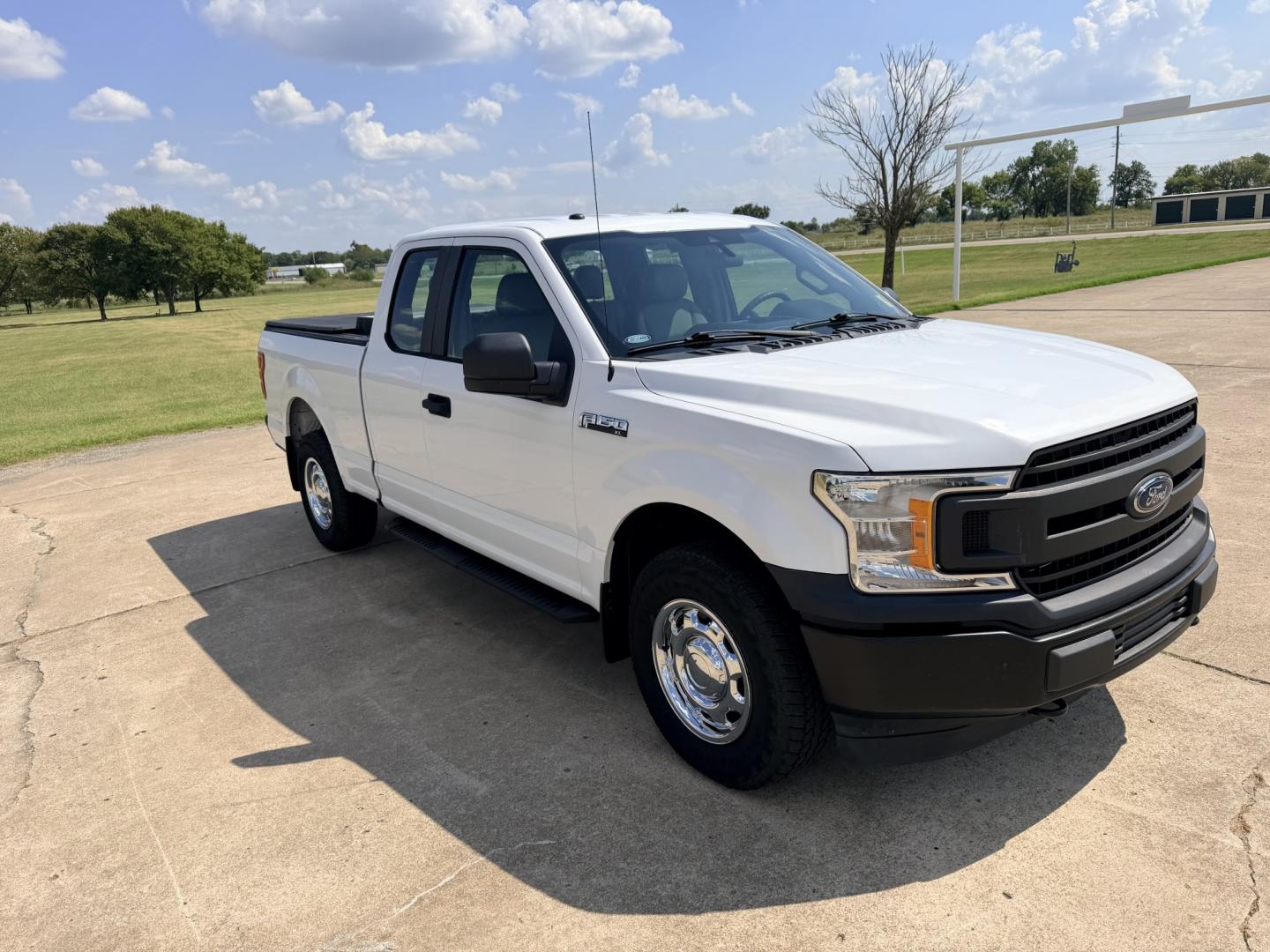 2019 White /Gray Ford F-150 (1FTFX1E54KK) with an 5.0L V8 OHV 16V engine, 6A transmission, located at 17760 Hwy 62, Morris, OK, 74445, (918) 733-4887, 35.609104, -95.877060 - 2019 FORD F150 HAS A 5.0L V8 ENGINE AND IS 4WD. FEATURES KEYLESS ENTERY, LEATHER INTERIOR, POWER WINDOWS, POWER LOCKS, POWER MIRRORS, AM/FM RADIO, HANDS FREE CALLING, A/C, TRACTION CONTROL,USB PORT, BACKUP CAMERA, BED COVER, AND BED LINER. EQUIPPED WITH A BI-FUEL CNG FUEL SYSTEM. IT RUNS ON COMPRESS- Photo#2