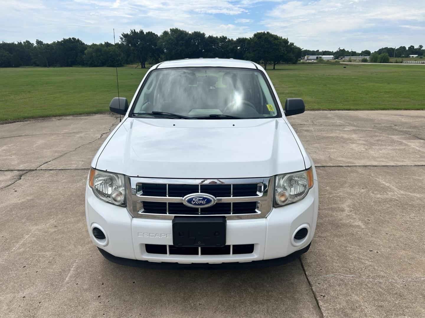 2011 WHITE /Gray Ford Escape (1FMCU9C75BK) with an 2.5L L4 DOHC 16V engine, 6-Speed Automatic transmission, located at 17760 Hwy 62, Morris, OK, 74445, (918) 733-4887, 35.609104, -95.877060 - 2011 FORD ESCAPE AWD AND HAS THE 2.5L L4 ENGINE. DEDICATED CNG ONLY RUNS ON COMPRESSED NATURAL GAS. IT FEATURES CLOTH INTERIOR, MANUAL SEATS, POWER WINDOWS, POWER LOCKS,CRUISE CONTROL, AM/FM RADIO, SIRIUS RADIO, CD PLAYER, AUXILARY PORT, AND HAND FREE CALLING. TIRES 235/70R16 AND ONLY HAS 111,801 M - Photo#1
