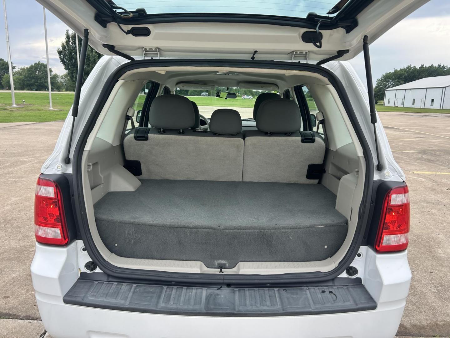 2011 WHITE /Gray Ford Escape (1FMCU9C75BK) with an 2.5L L4 DOHC 16V engine, 6-Speed Automatic transmission, located at 17760 Hwy 62, Morris, OK, 74445, (918) 733-4887, 35.609104, -95.877060 - 2011 FORD ESCAPE AWD AND HAS THE 2.5L L4 ENGINE. DEDICATED CNG ONLY RUNS ON COMPRESSED NATURAL GAS. IT FEATURES CLOTH INTERIOR, MANUAL SEATS, POWER WINDOWS, POWER LOCKS,CRUISE CONTROL, AM/FM RADIO, SIRIUS RADIO, CD PLAYER, AUXILARY PORT, AND HAND FREE CALLING. TIRES 235/70R16 AND ONLY HAS 111,801 M - Photo#13