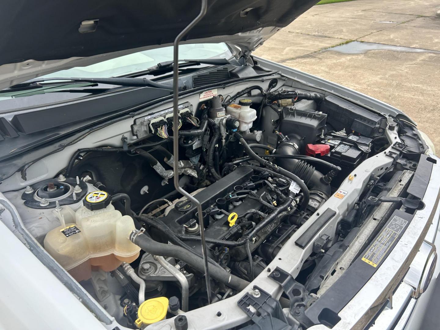 2011 WHITE /Gray Ford Escape (1FMCU9C75BK) with an 2.5L L4 DOHC 16V engine, 6-Speed Automatic transmission, located at 17760 Hwy 62, Morris, OK, 74445, (918) 733-4887, 35.609104, -95.877060 - 2011 FORD ESCAPE AWD AND HAS THE 2.5L L4 ENGINE. DEDICATED CNG ONLY RUNS ON COMPRESSED NATURAL GAS. IT FEATURES CLOTH INTERIOR, MANUAL SEATS, POWER WINDOWS, POWER LOCKS,CRUISE CONTROL, AM/FM RADIO, SIRIUS RADIO, CD PLAYER, AUXILARY PORT, AND HAND FREE CALLING. TIRES 235/70R16 AND ONLY HAS 111,801 M - Photo#19