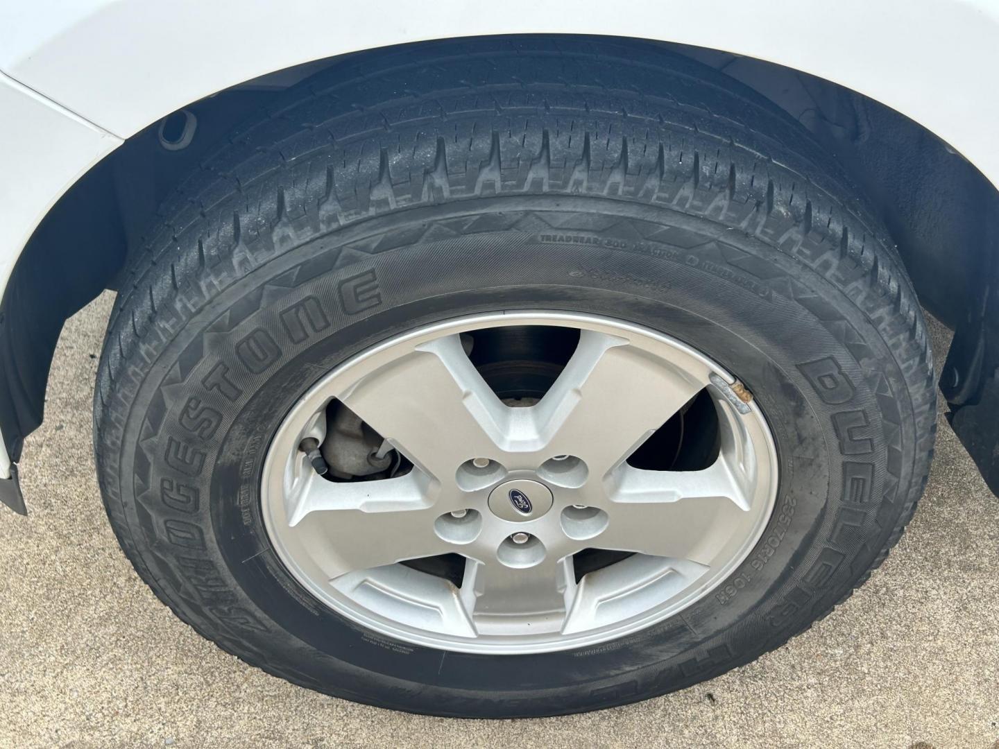 2011 WHITE /Gray Ford Escape (1FMCU9C75BK) with an 2.5L L4 DOHC 16V engine, 6-Speed Automatic transmission, located at 17760 Hwy 62, Morris, OK, 74445, (918) 733-4887, 35.609104, -95.877060 - 2011 FORD ESCAPE AWD AND HAS THE 2.5L L4 ENGINE. DEDICATED CNG ONLY RUNS ON COMPRESSED NATURAL GAS. IT FEATURES CLOTH INTERIOR, MANUAL SEATS, POWER WINDOWS, POWER LOCKS,CRUISE CONTROL, AM/FM RADIO, SIRIUS RADIO, CD PLAYER, AUXILARY PORT, AND HAND FREE CALLING. TIRES 235/70R16 AND ONLY HAS 111,801 M - Photo#22