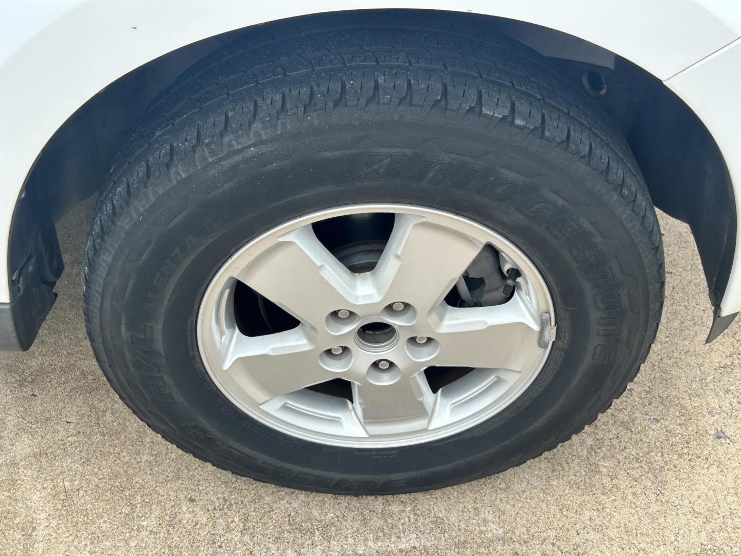2011 WHITE /Gray Ford Escape (1FMCU9C75BK) with an 2.5L L4 DOHC 16V engine, 6-Speed Automatic transmission, located at 17760 Hwy 62, Morris, OK, 74445, (918) 733-4887, 35.609104, -95.877060 - 2011 FORD ESCAPE AWD AND HAS THE 2.5L L4 ENGINE. DEDICATED CNG ONLY RUNS ON COMPRESSED NATURAL GAS. IT FEATURES CLOTH INTERIOR, MANUAL SEATS, POWER WINDOWS, POWER LOCKS,CRUISE CONTROL, AM/FM RADIO, SIRIUS RADIO, CD PLAYER, AUXILARY PORT, AND HAND FREE CALLING. TIRES 235/70R16 AND ONLY HAS 111,801 M - Photo#23