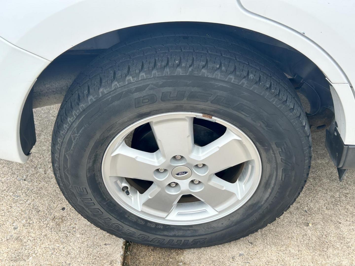2011 WHITE /Gray Ford Escape (1FMCU9C75BK) with an 2.5L L4 DOHC 16V engine, 6-Speed Automatic transmission, located at 17760 Hwy 62, Morris, OK, 74445, (918) 733-4887, 35.609104, -95.877060 - 2011 FORD ESCAPE AWD AND HAS THE 2.5L L4 ENGINE. DEDICATED CNG ONLY RUNS ON COMPRESSED NATURAL GAS. IT FEATURES CLOTH INTERIOR, MANUAL SEATS, POWER WINDOWS, POWER LOCKS,CRUISE CONTROL, AM/FM RADIO, SIRIUS RADIO, CD PLAYER, AUXILARY PORT, AND HAND FREE CALLING. TIRES 235/70R16 AND ONLY HAS 111,801 M - Photo#24